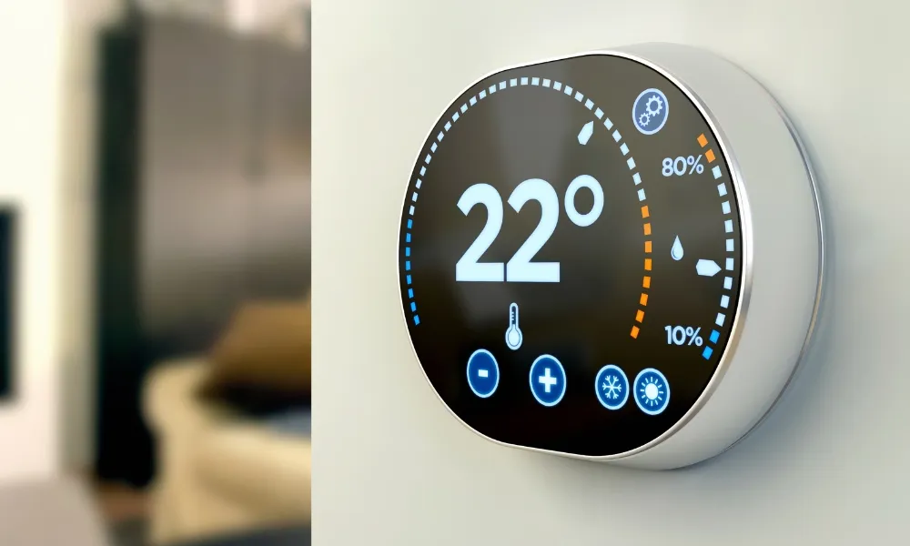 round thermostat attached to the wall